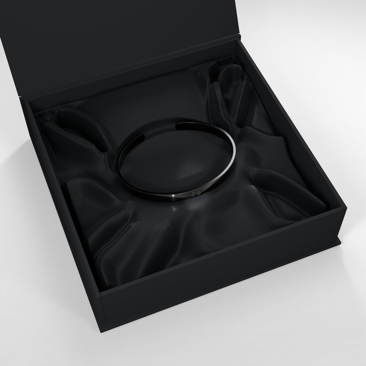 Black bracelet in the open HOWL presentation box