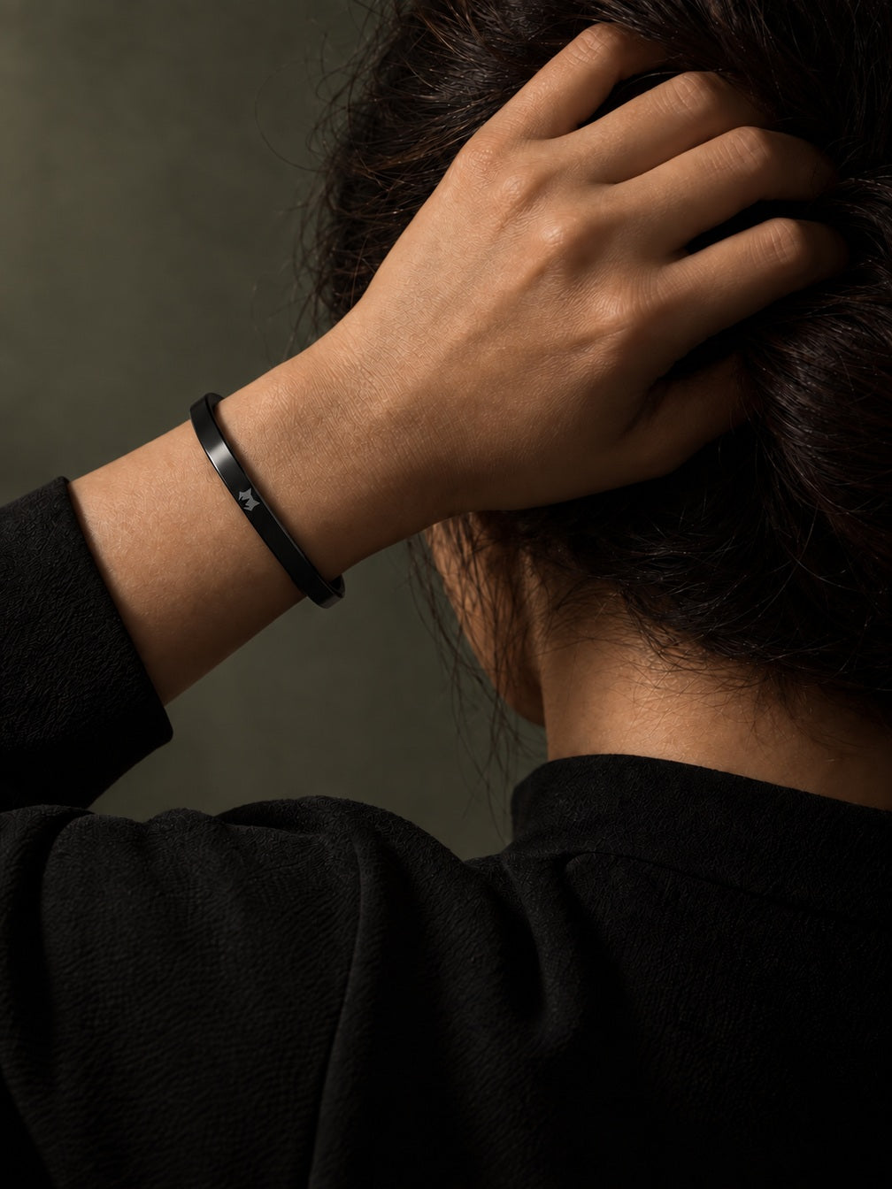 Black Signature Cuff worn on the wrist