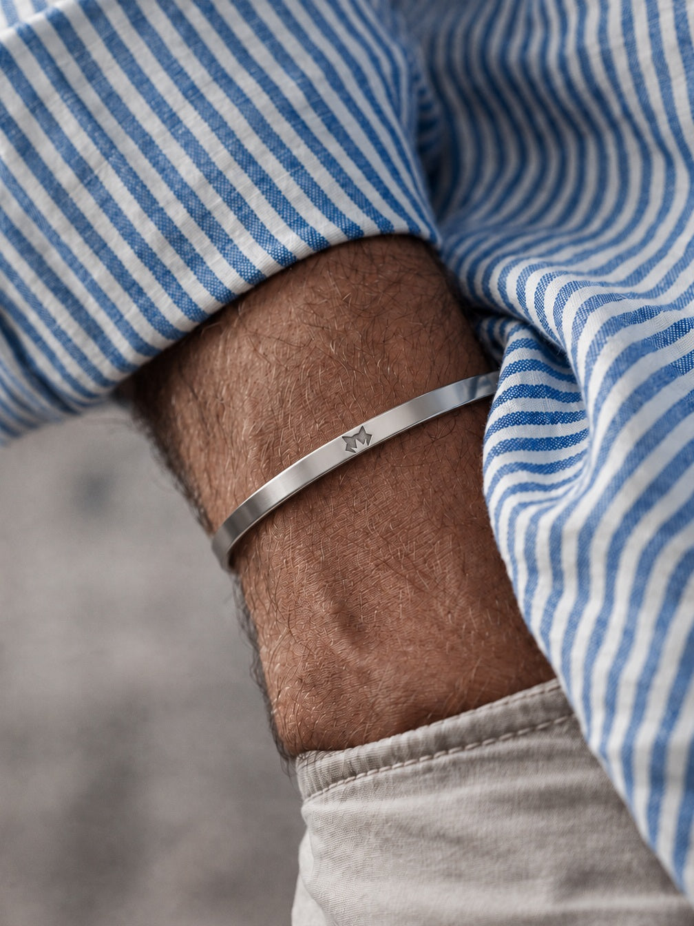 Silver Signature Cuff worn on the wrist