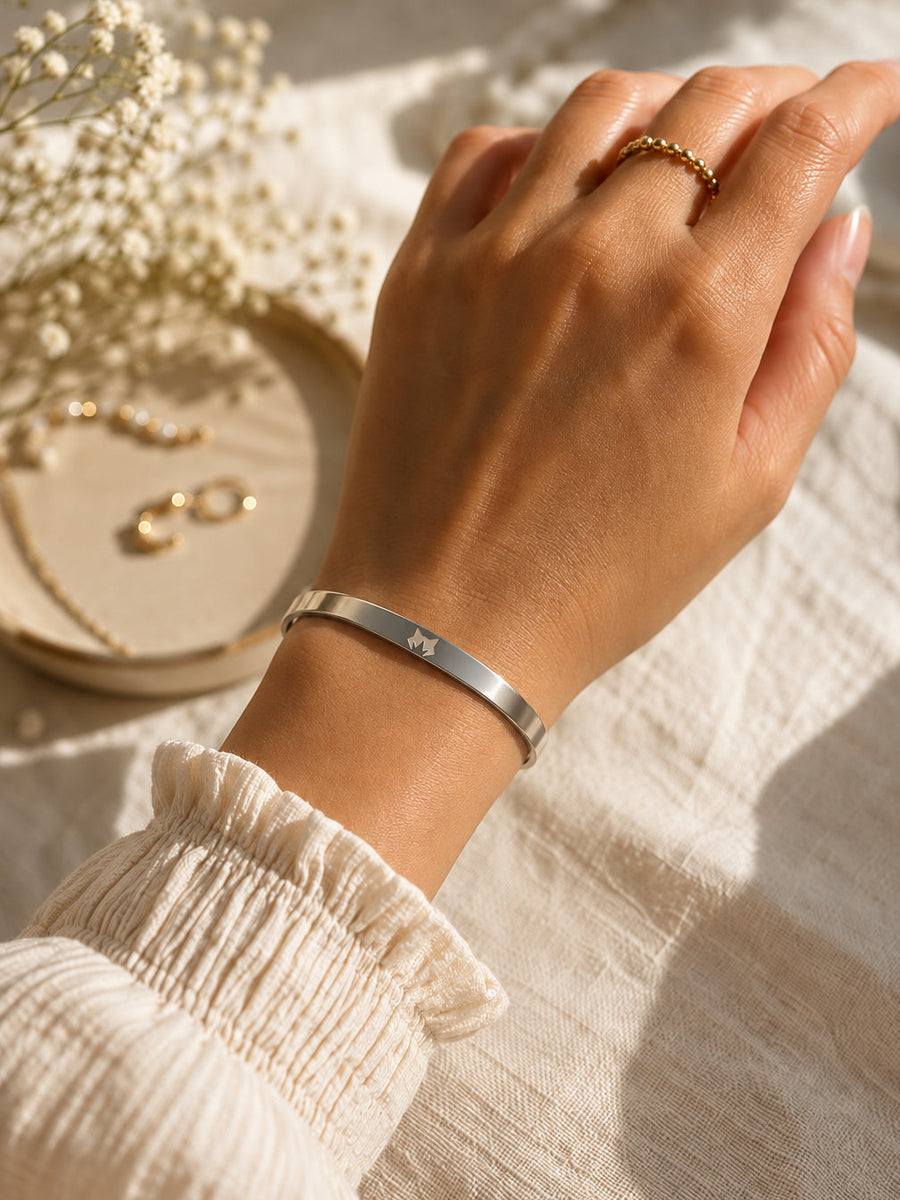 Silver Signature Cuff worn on the wrist