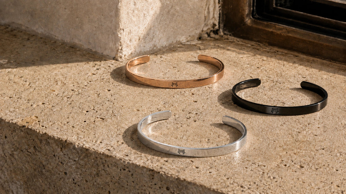 Black, Rose Gold and Silver cuffs on sunlit stone